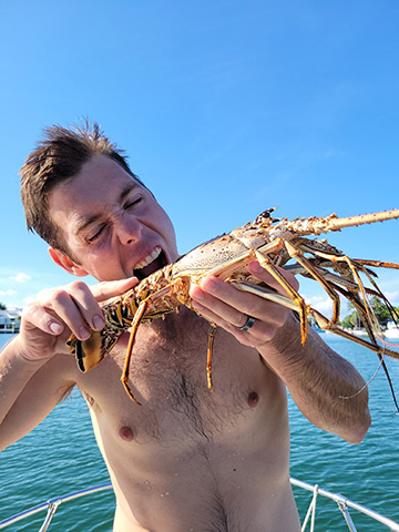 Lobster Diving Off Sailboat